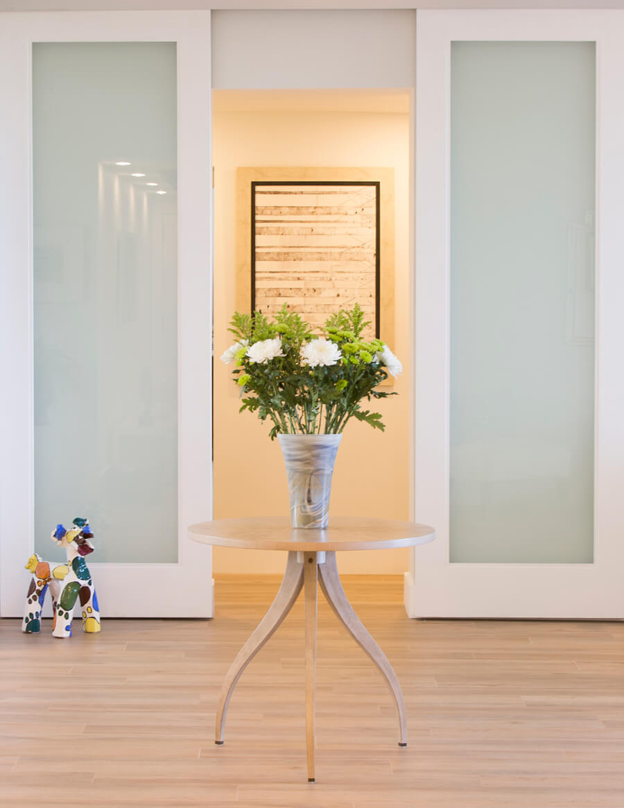 Zebra wood and porcelain tile in a Palm Beach condo