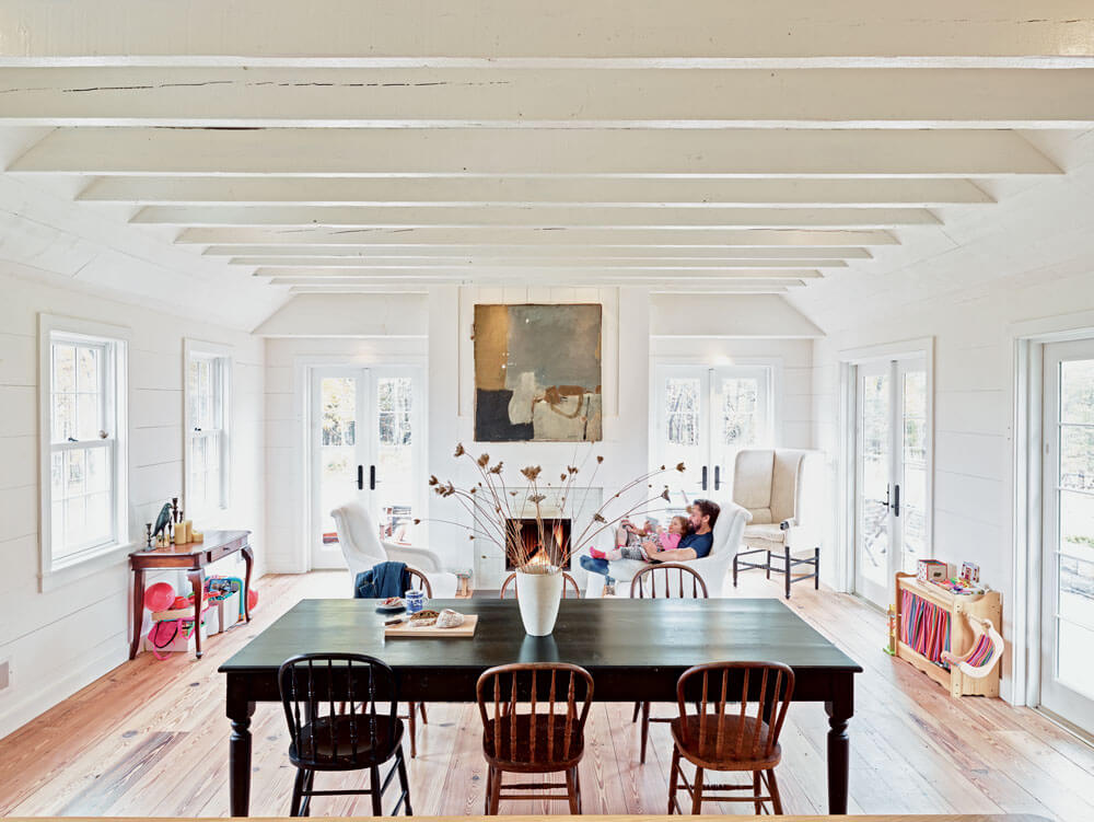 Taavo Somer’s living room in his Upstate stone cabin | Corcoran