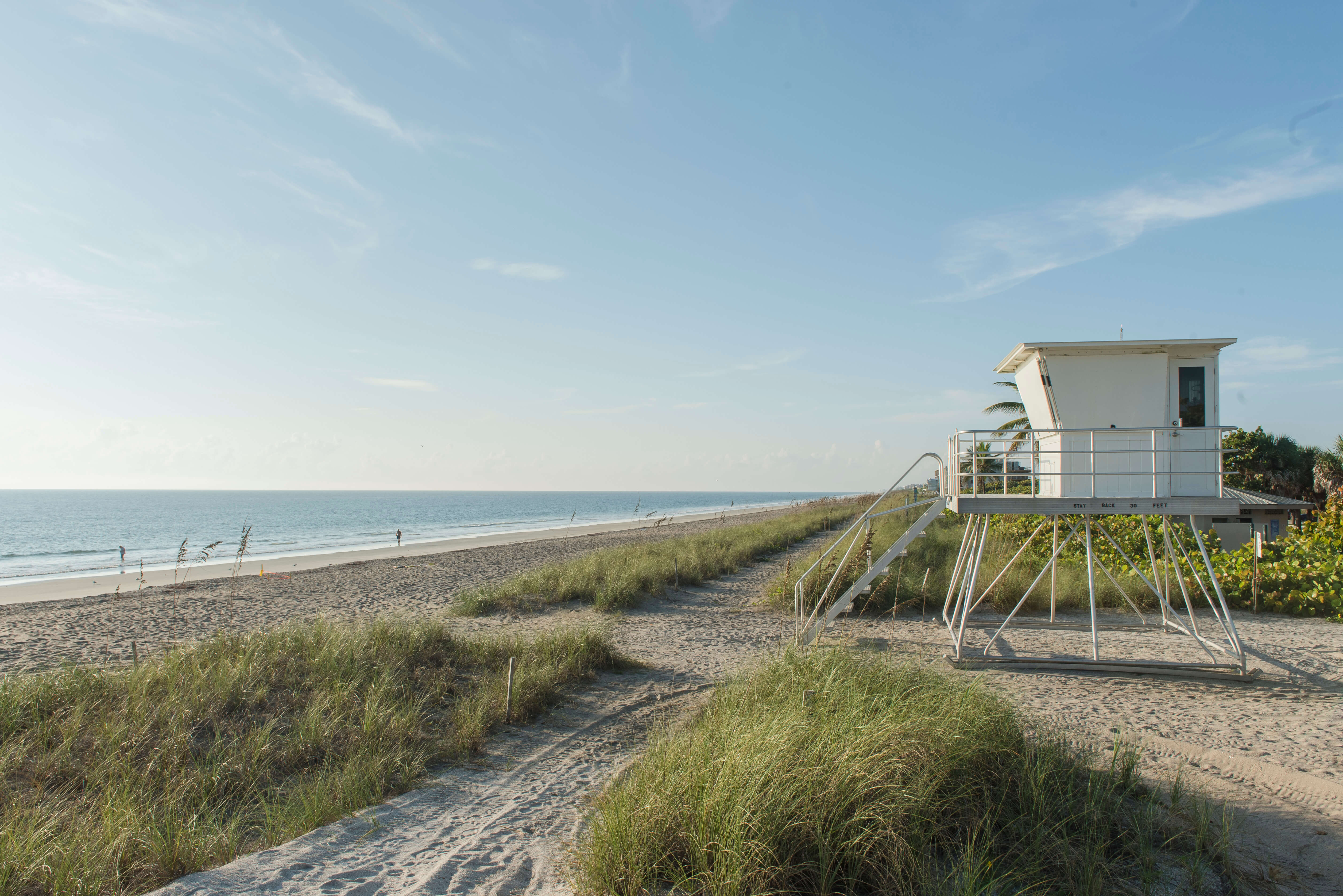 A South Florida beach with a wooden lifeguard tower | Corcoran