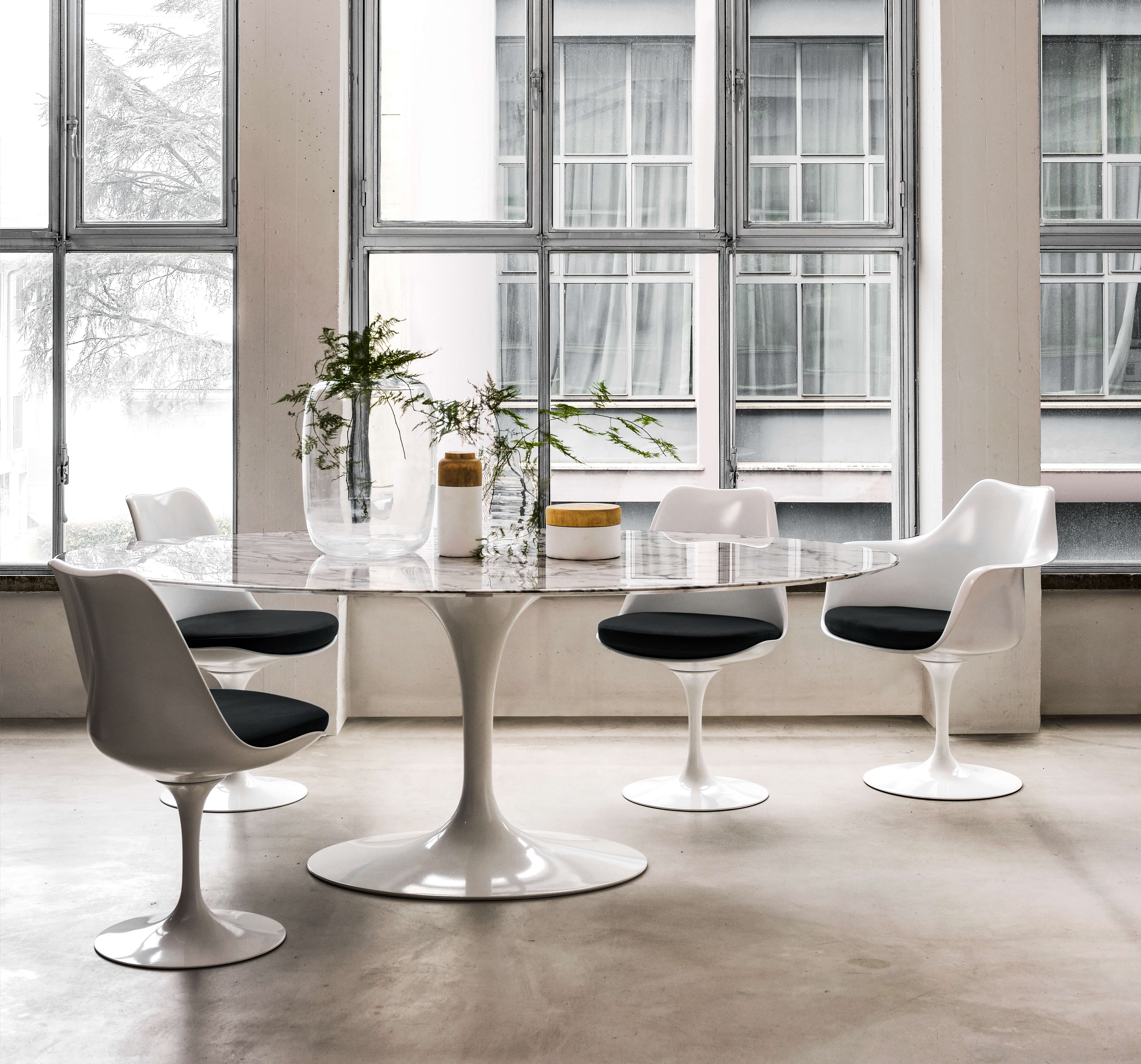 A laminate and marble table designed by midcentury modernist Eero Saarinen | Corcoran