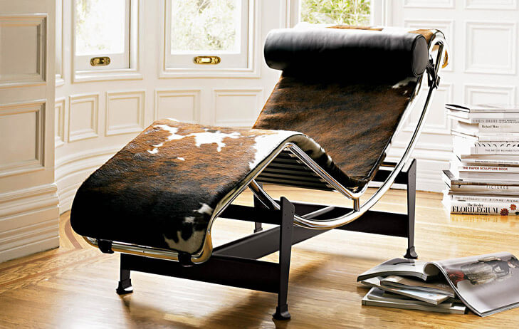 A moveable chair covered in leather or cowhide designed by Pierre Jeanneret and Charlotte Perriand | Corcoran