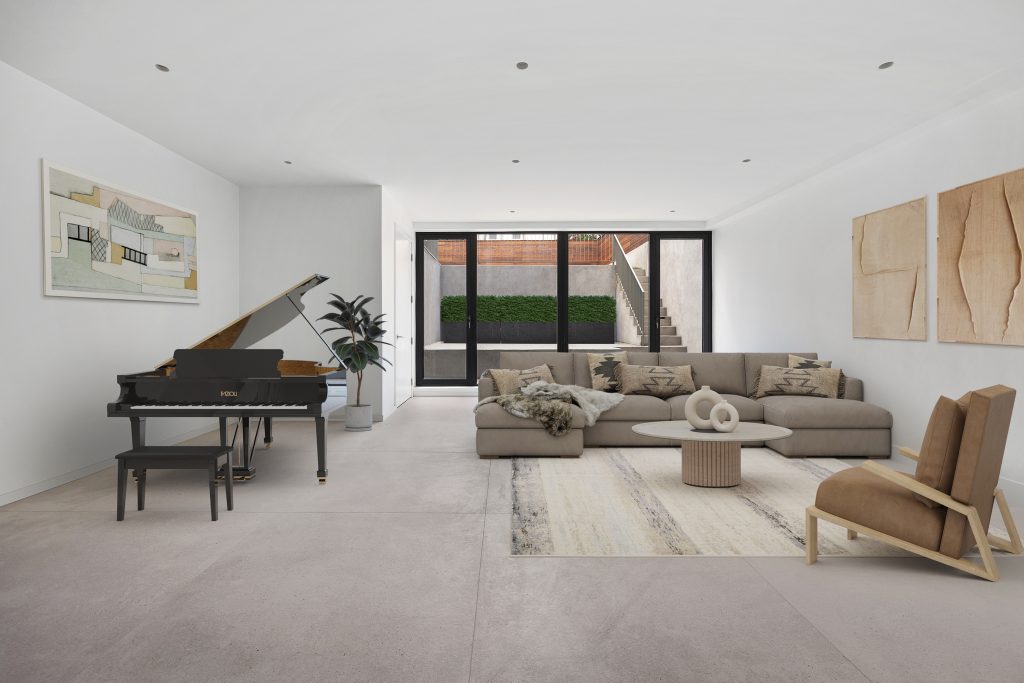 The lower level of 257 13th Street, Unit 1 connects to a sunken patio and has space for a grand piano.