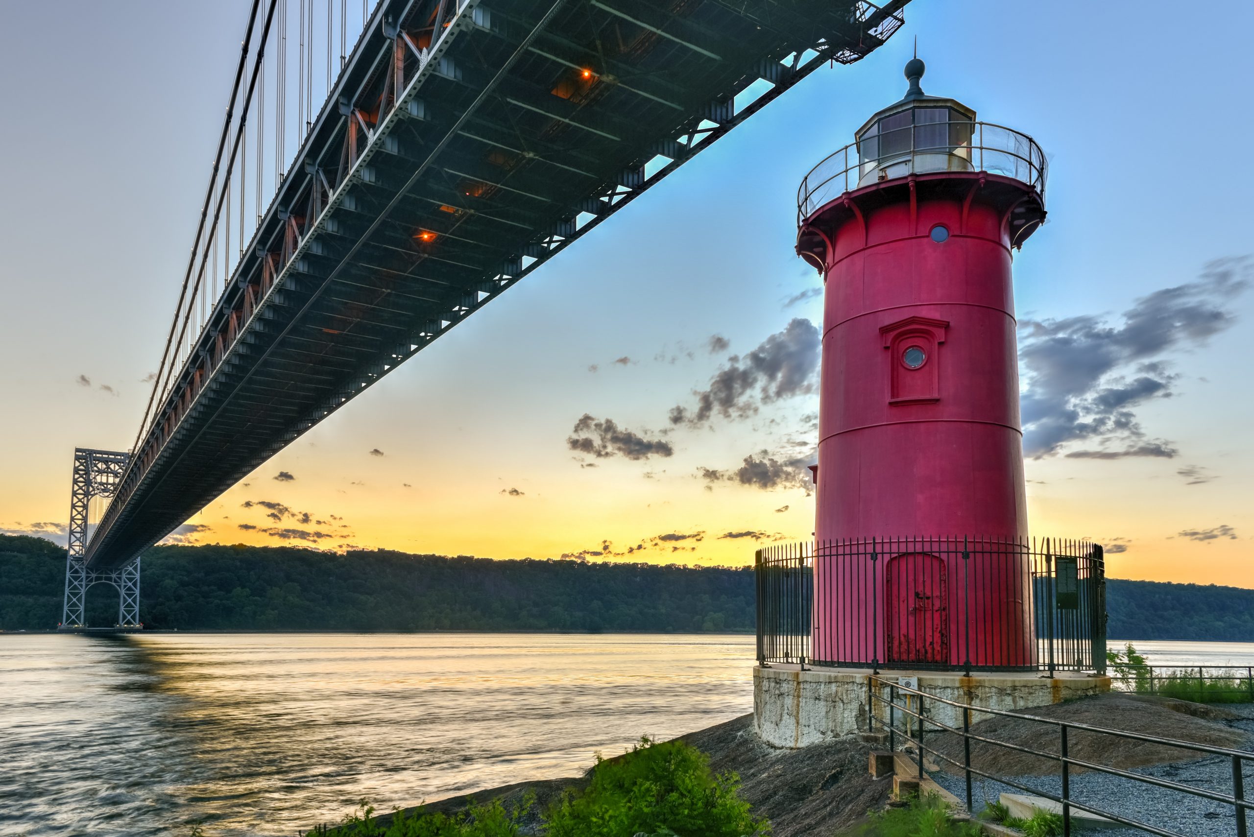 NYC's Little Red Lighthouse, standing on the shores of the Hudson River beneath the GW Bridge in Fort Washington Park.