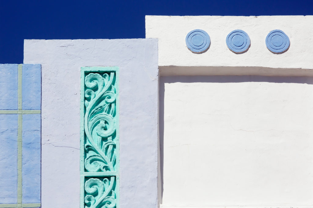 Different shades of blue, green, and white help define the Art Deco character of this Miami Beach building.