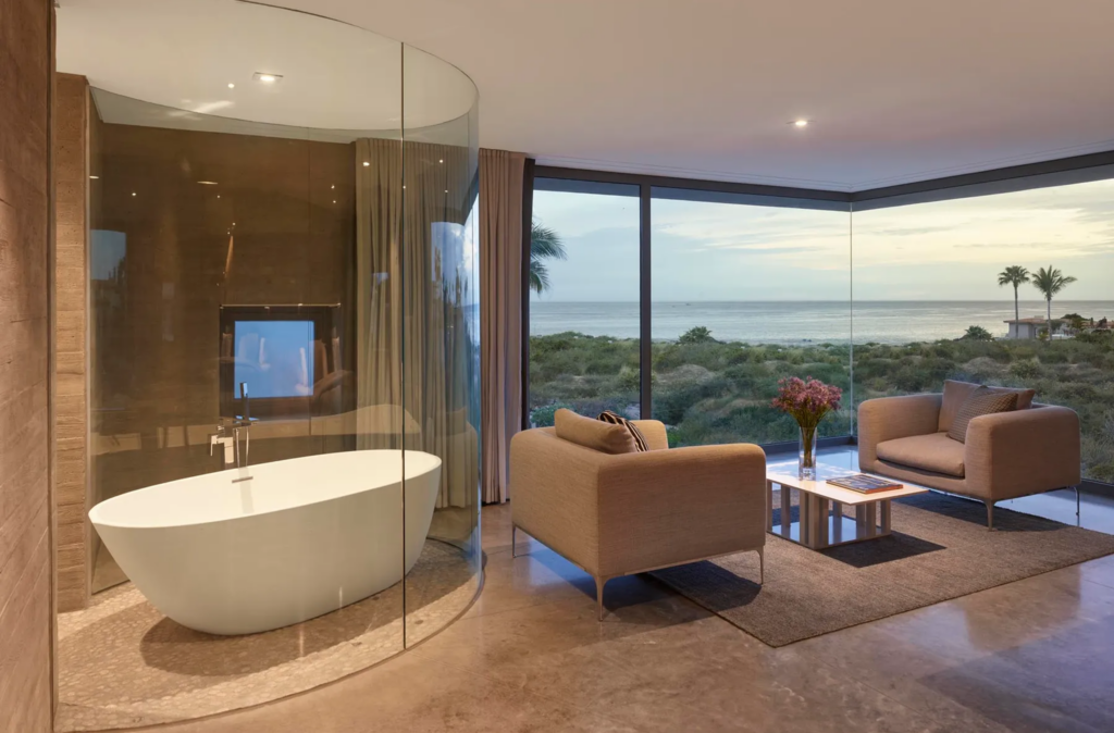 The glass-enclosed, freestanding bathtub has brilliant views of the Cabo area.