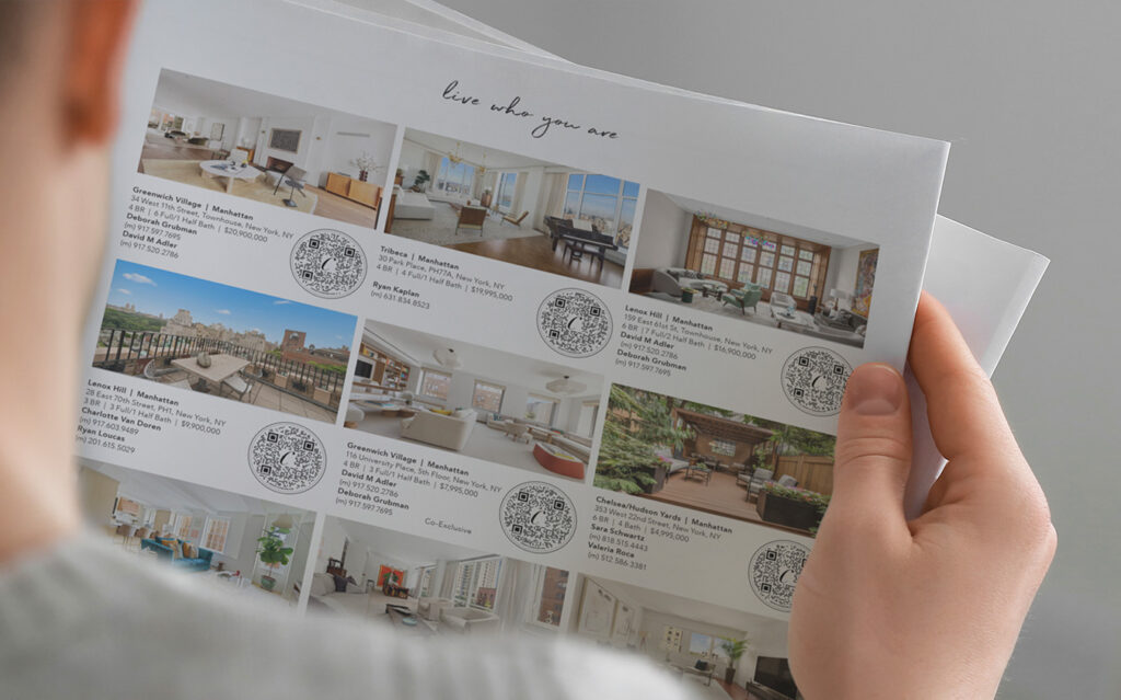 A person holds a brochure displaying several luxury real estate listings with photos, descriptions, prices, and QR codes for each property. The heading at the top reads, Live where you are.