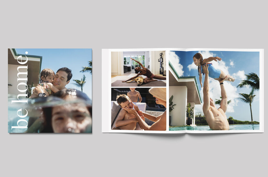 A photo book with the cover showing a family swimming and the words be home. Inside pages display warm family moments: swimming, playing with a dog indoors, relaxing by the pool, and a child being lifted in the pool.