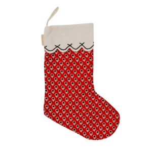 A red Christmas stocking with a repeating white and black floral pattern, a white scalloped cuff at the top, and a small hanging loop—perfect for tucking in small gifts or mini cookbooks for the holiday season.