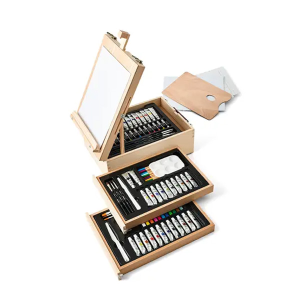 A wooden artist box with an easel holds trays of paint tubes, colored pencils, brushes, and a painter’s palette—perfect for holiday decorating projects—all organized neatly in pull-out compartments.