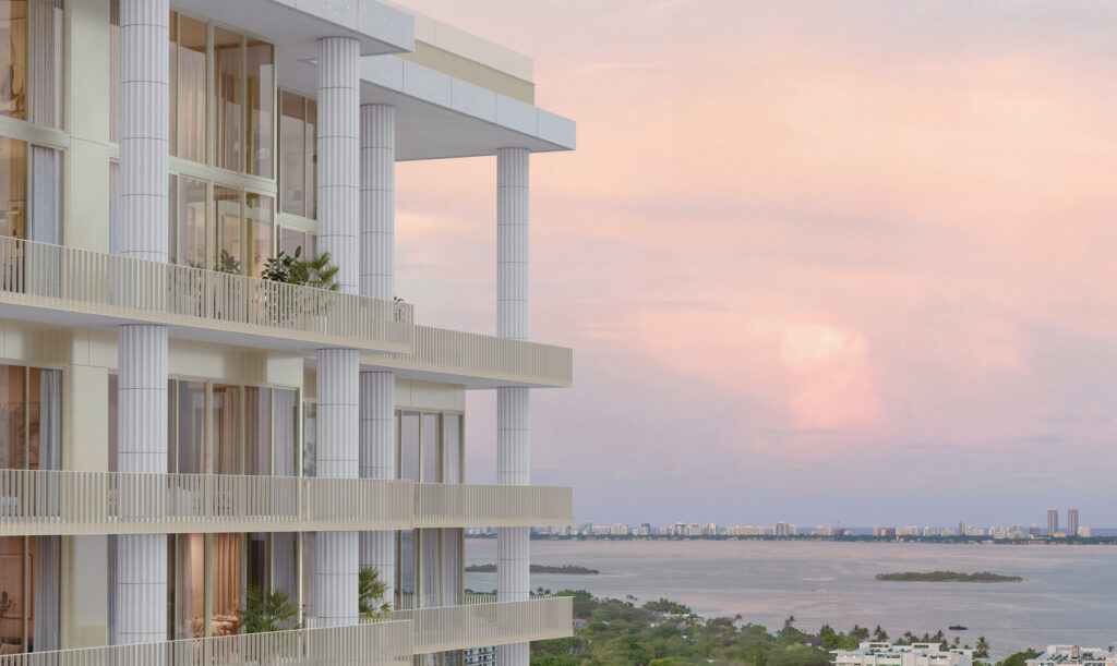 Fouquet’s Hotel and Residences Miami 39 NE 39th Street, Miami, FL 33137 Image of large luxury high-rise hotel with white columns against a sunset sky.